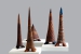 Szávoszt Katalin - Királyi család  2005, 133x50cm, 135x42cm, 129x56cm70x63cm, 115x35cm. Samottos agyagból, felrakásos/épített/ technikával. Olaj tüzeléssel, redukciósan égetve. Perforált.